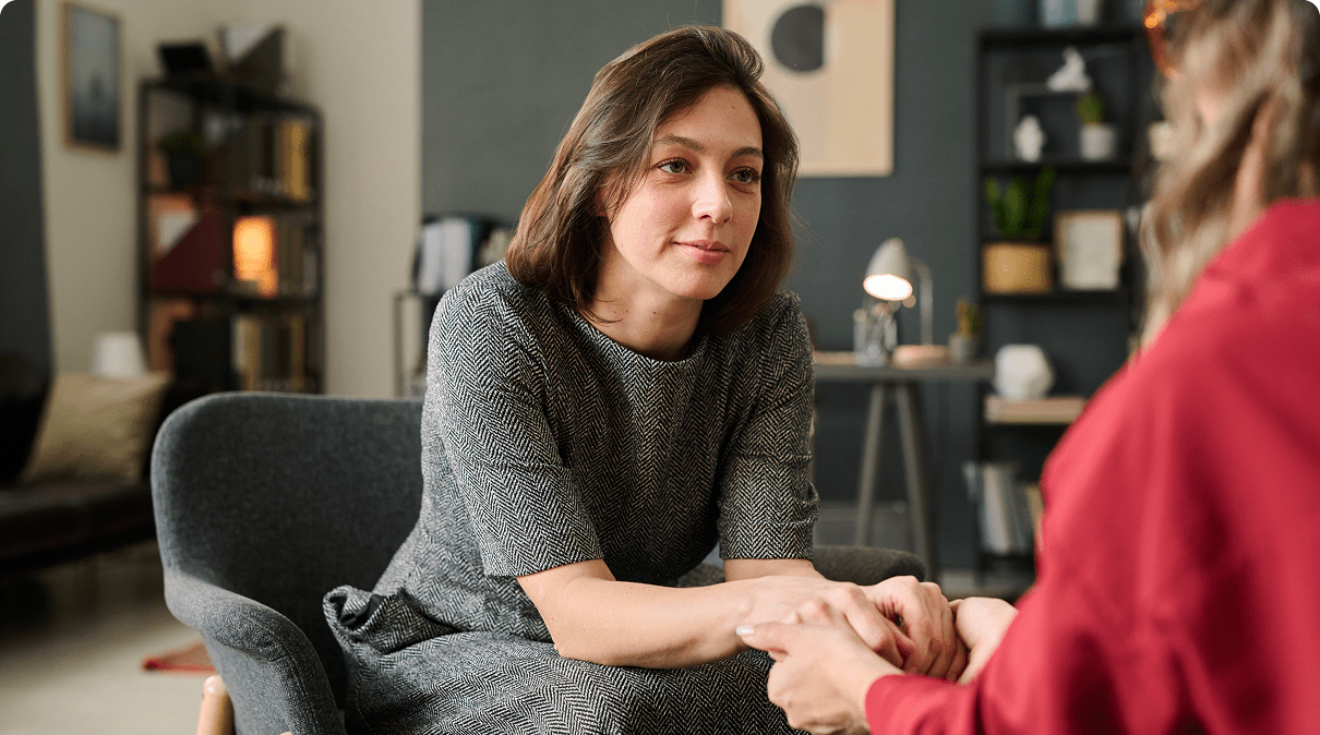 Woman offering support in a counseling session.